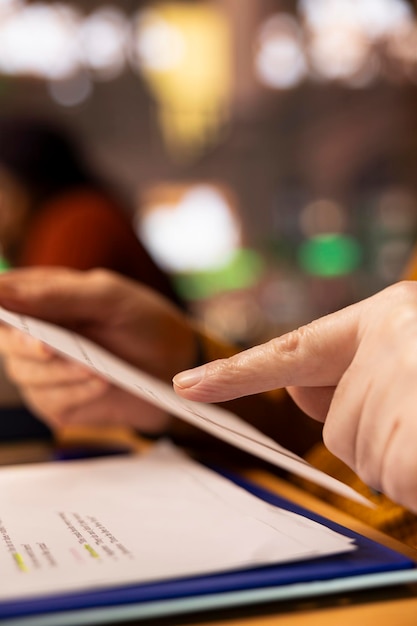 aged-student-with-focused-expression-reading-files-college-library_482257-122543(1)